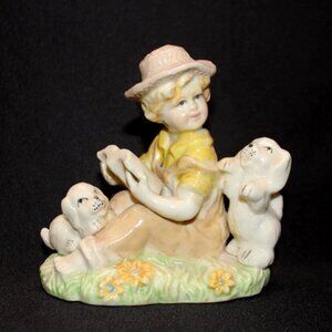 Ceramic Figurine Boy in Hat Reading to his Dogs